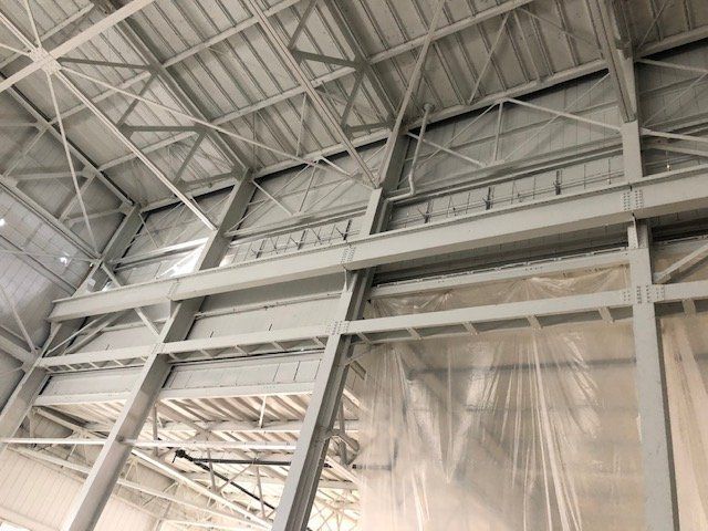 A large building with a ceiling that is covered in plastic.