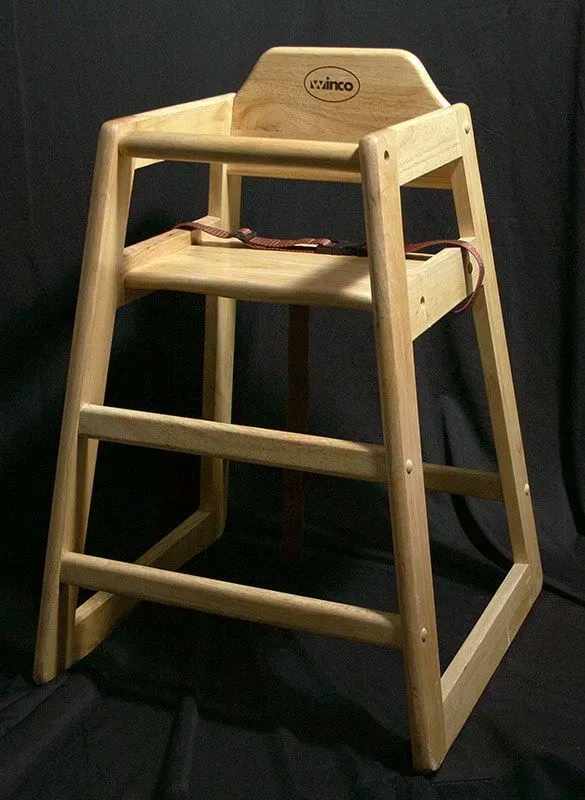 A light-colored wooden restaurant high chair with a leather safety strap, set against a black background.