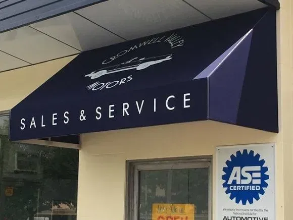 A navy blue awning for Cromwell Motors, labeled 