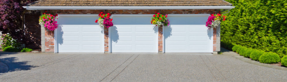 Triple doors garage with hanging flower pots