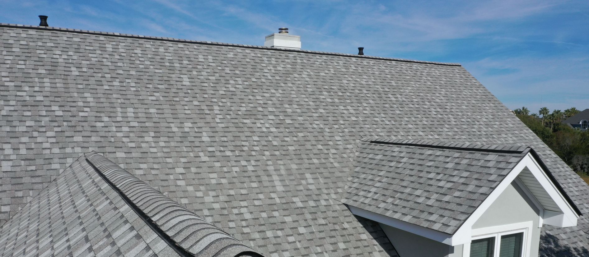 A close up of a roof with shingles on it.