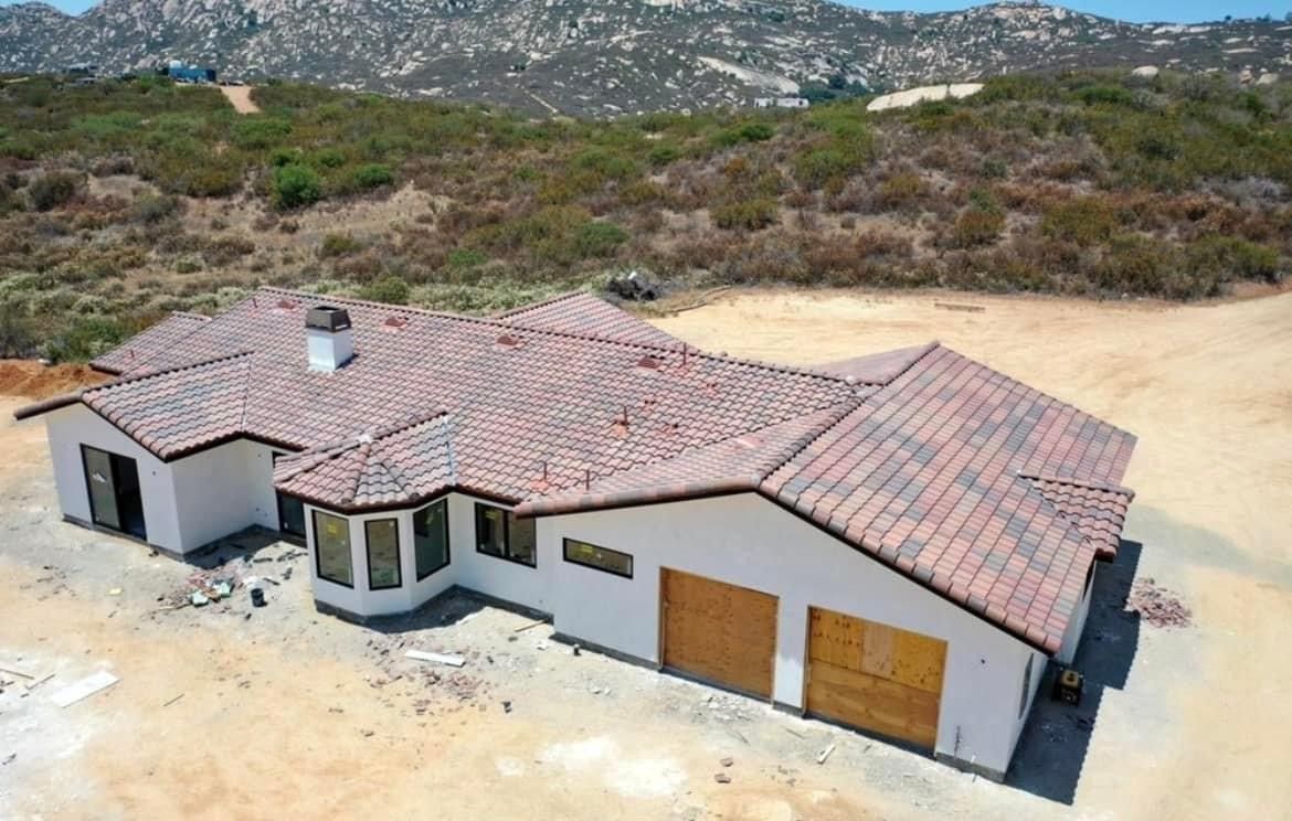 An aerial view of a house with a tiled roof
