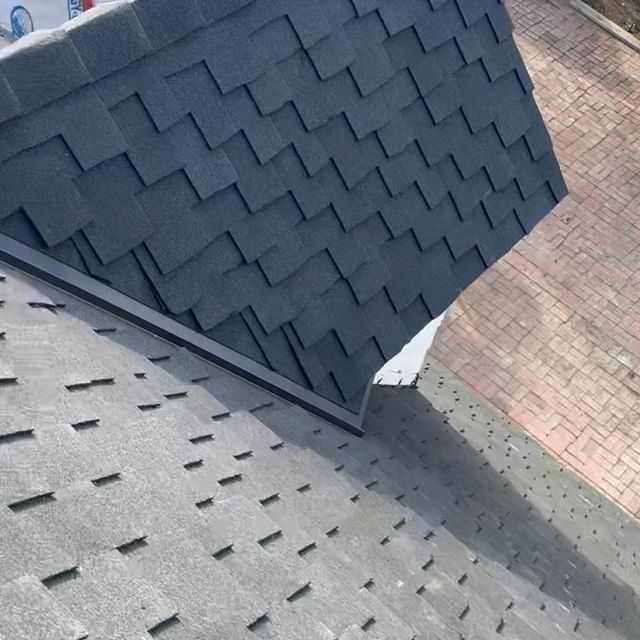 A close up of a roof with shingles on it