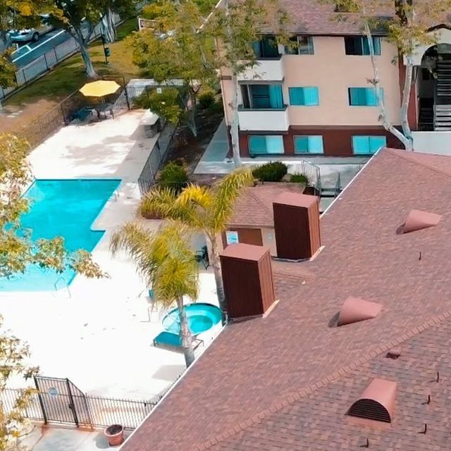 An aerial view of a house with a swimming pool