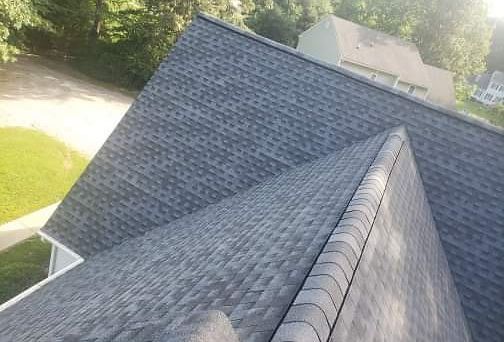 Dark gray shingled roof on a residential building.