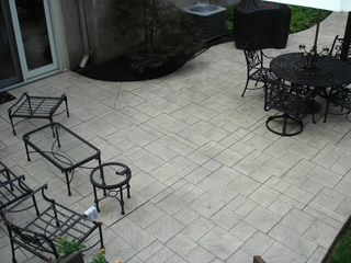 An aerial view of a patio with a table and chairs.