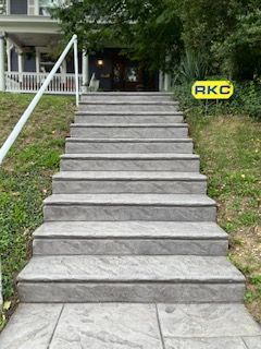A set of stairs leading up to a house.