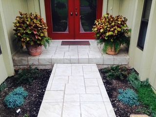 A walkway leading to the front door of a house