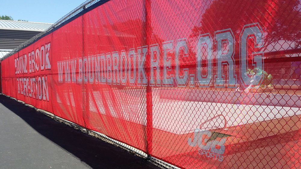 Baseball and softball walls - with custom windscreens or wall padding