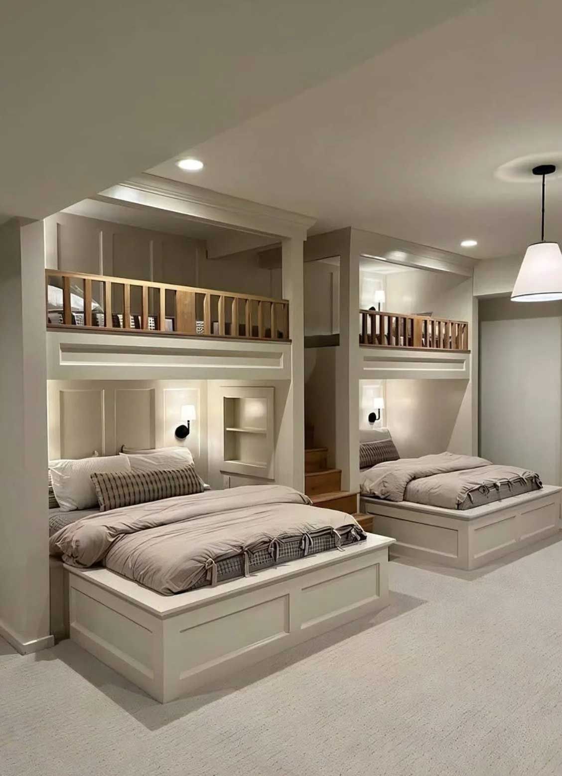 Bunk beds in a neutral-toned bedroom. Each bed features a lower double bed and an upper level with a small railing.