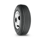 A close up of a tire on a white background.