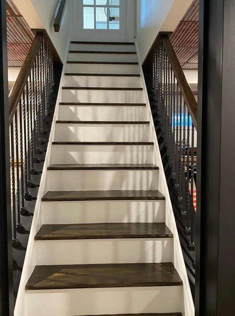 A set of stairs leading up to the second floor of a house.