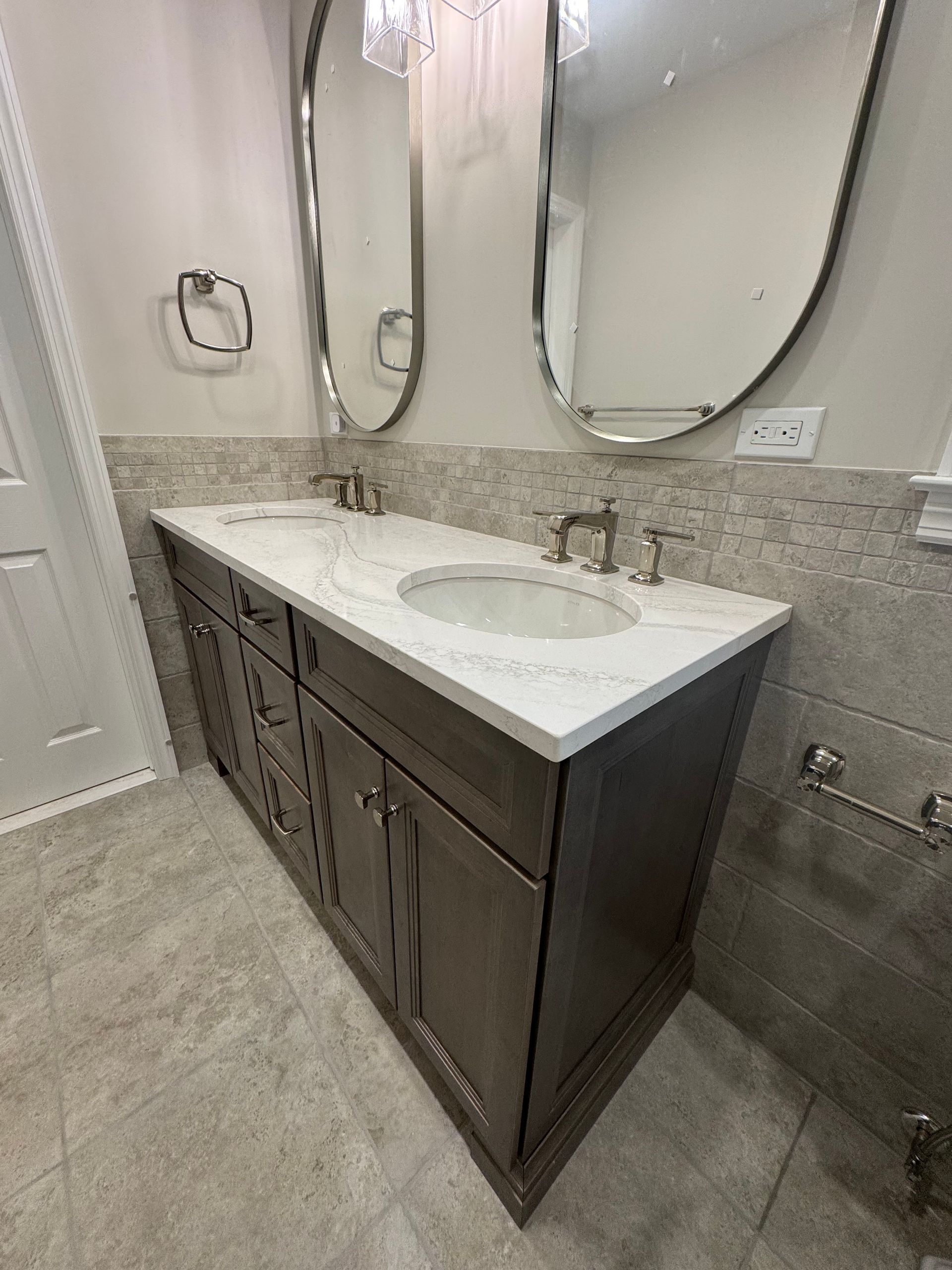 A bathroom with two sinks and two mirrors.
