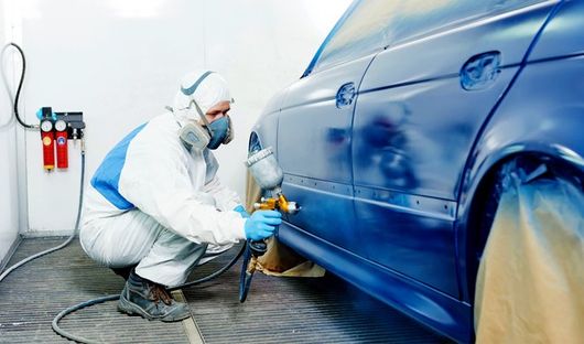 Car being painted with blue