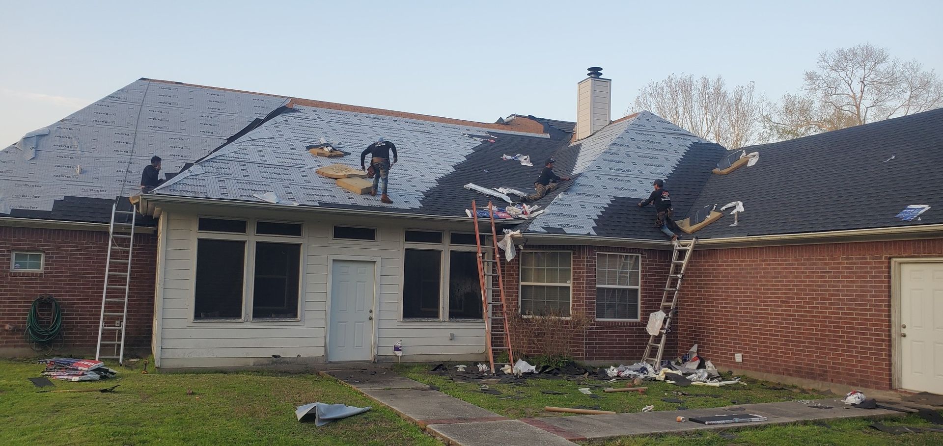 A house with a roof that is being repaired.