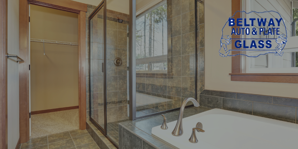 Bathroom with shower, bathtub, window, and Beltway Auto & Plate Glass logo.
