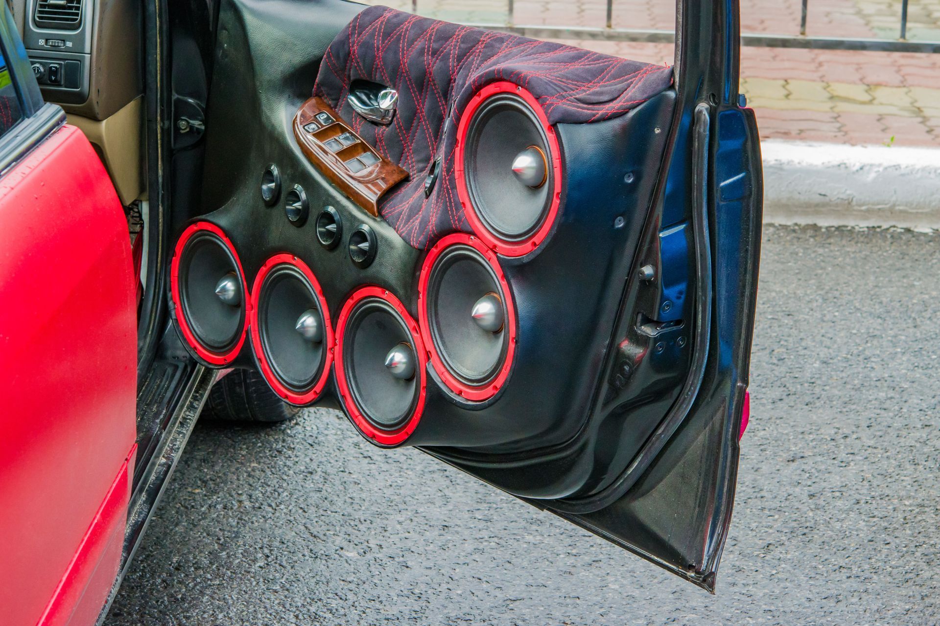 A car door with a lot of speakers in it.