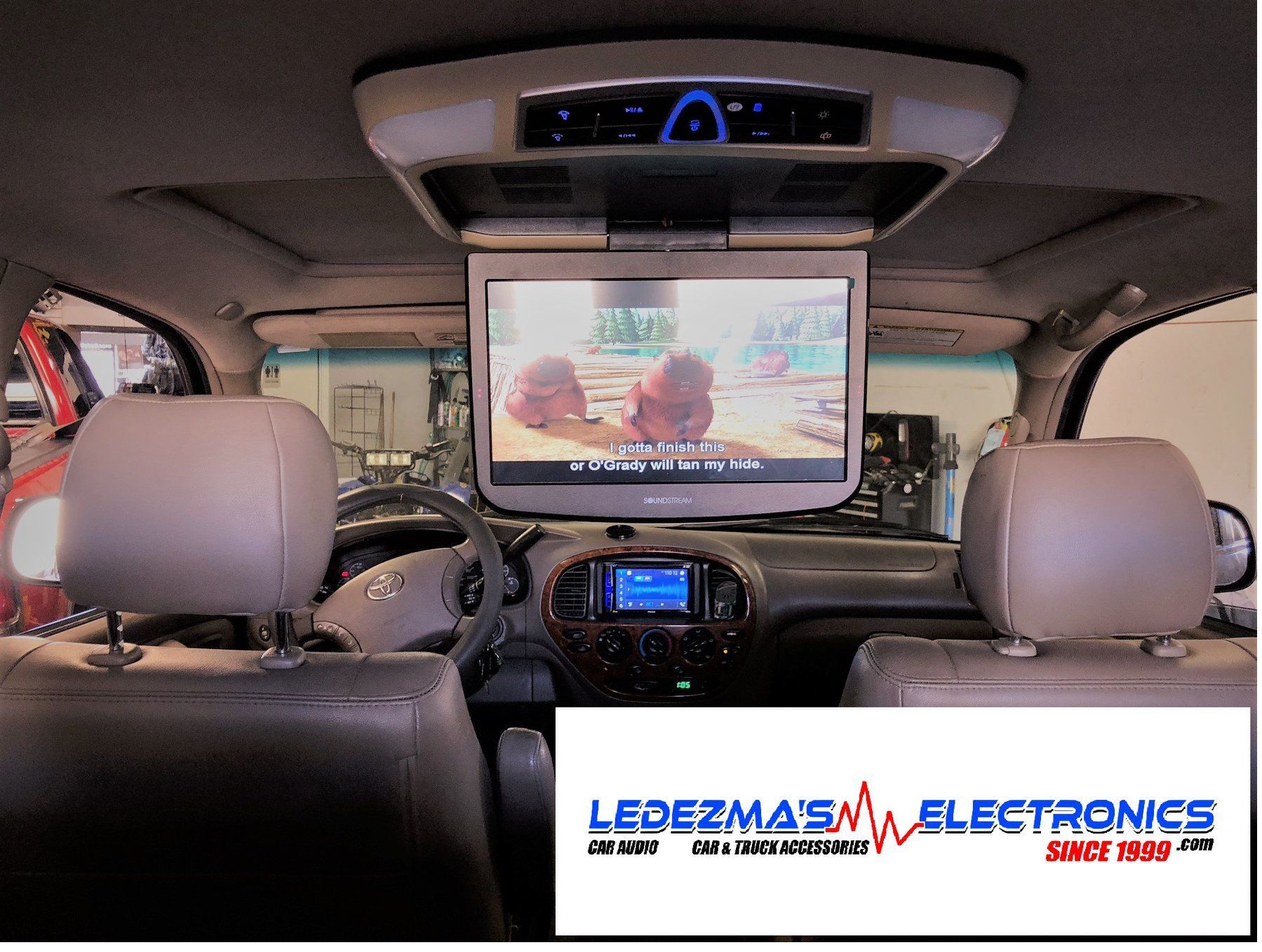 A picture of a car with a tv mounted to the ceiling