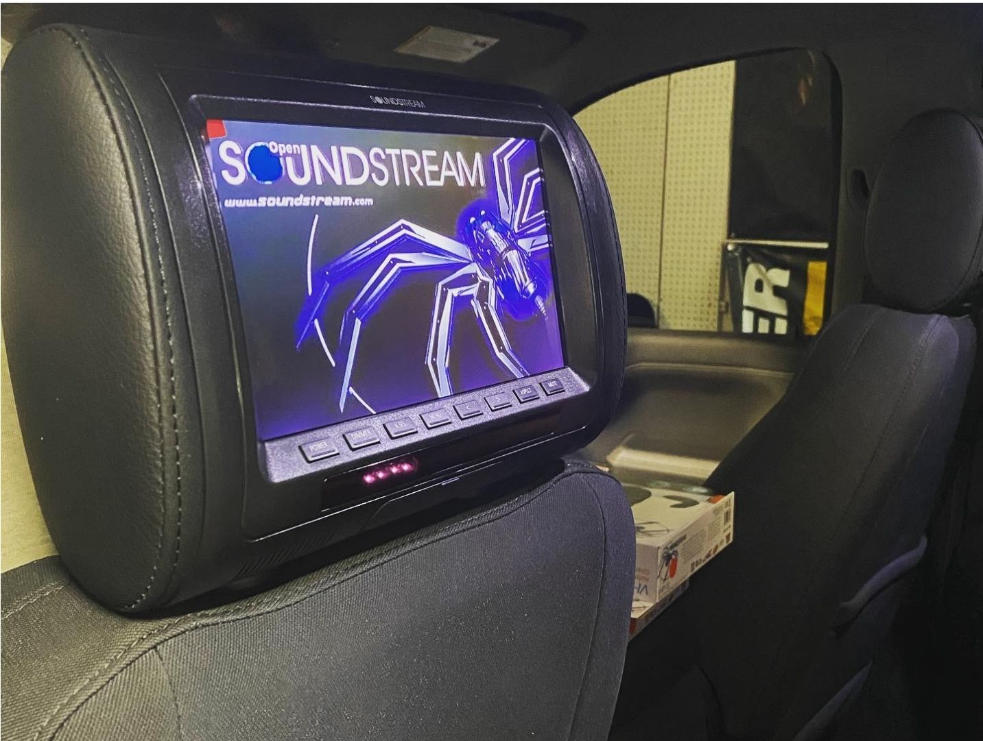 A headrest monitor with the word soundstream on it