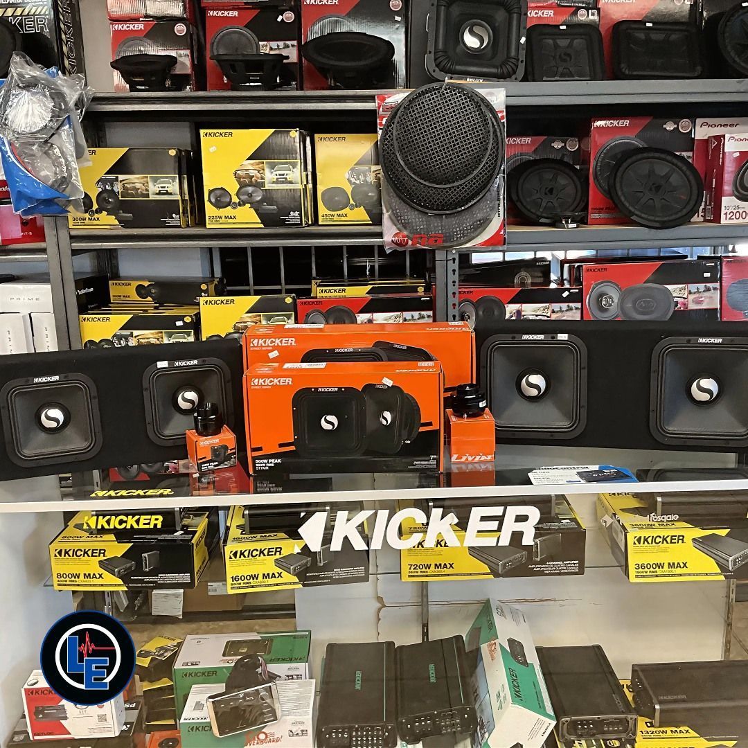 A store filled with lots of speakers including kicker speakers.