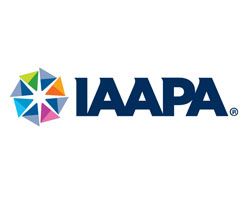 A logo for iaapa with a colorful star on a white background.
