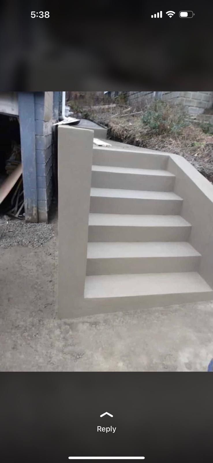 A person is taking a picture of a set of stairs