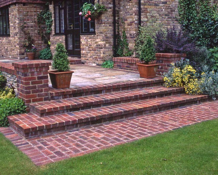 A set of brick steps leading up to a brick house