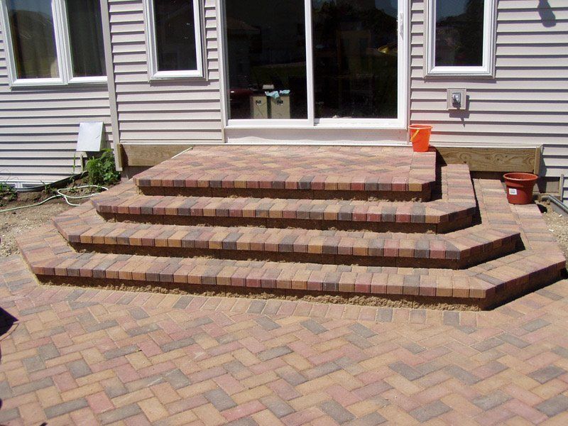 A set of brick steps leading up to a house