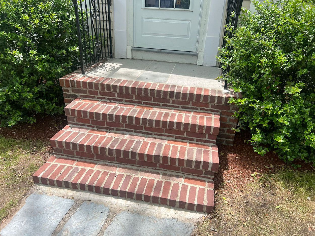 A set of brick steps leading up to a house