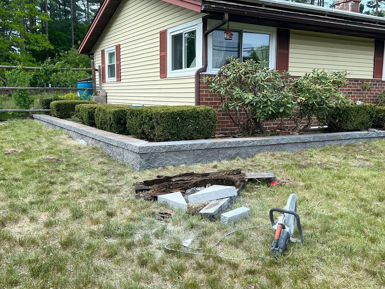 A house with a newly layered garden retaining wall