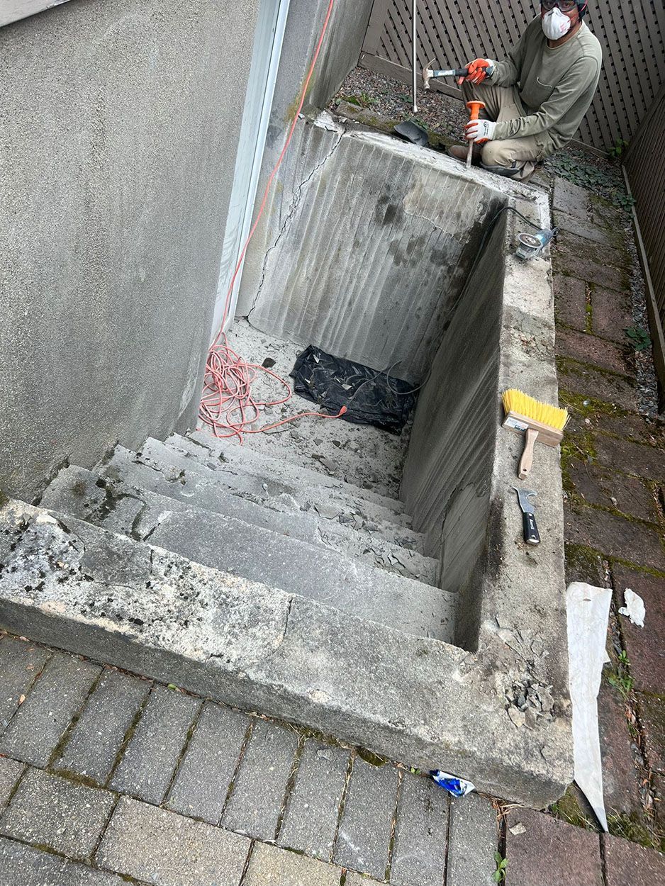 A man repairing a stair