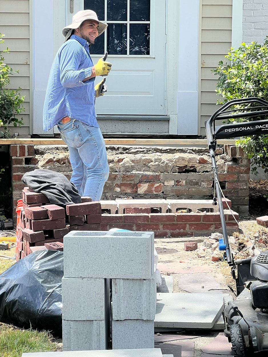 A man is working on an old stairs