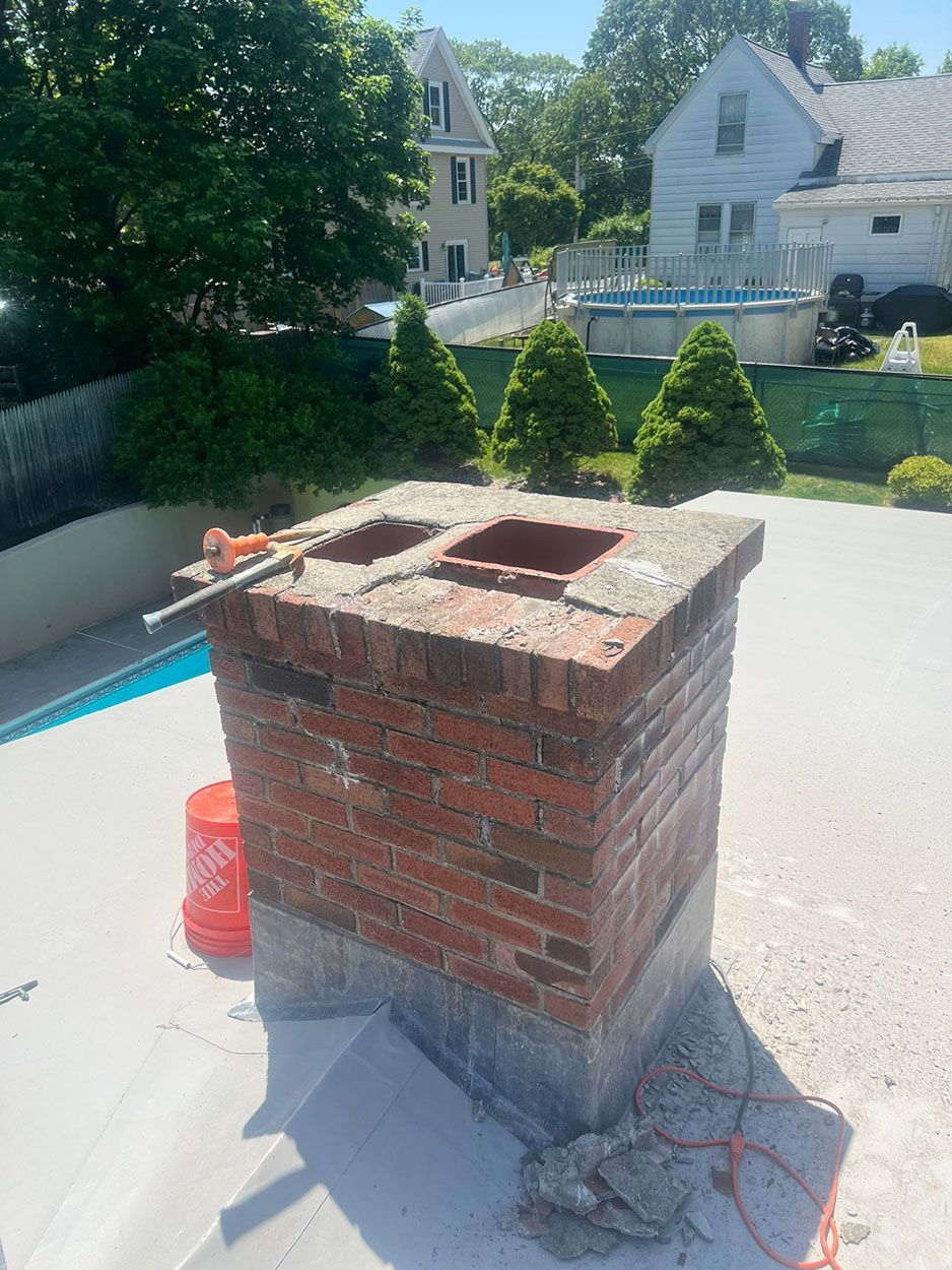A brick chimney is being built