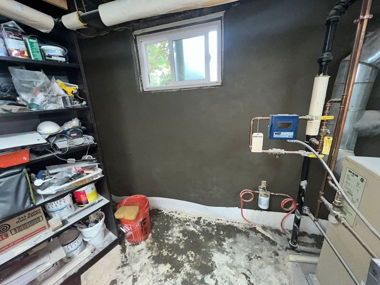 A room with a window and a lot of pipes in it