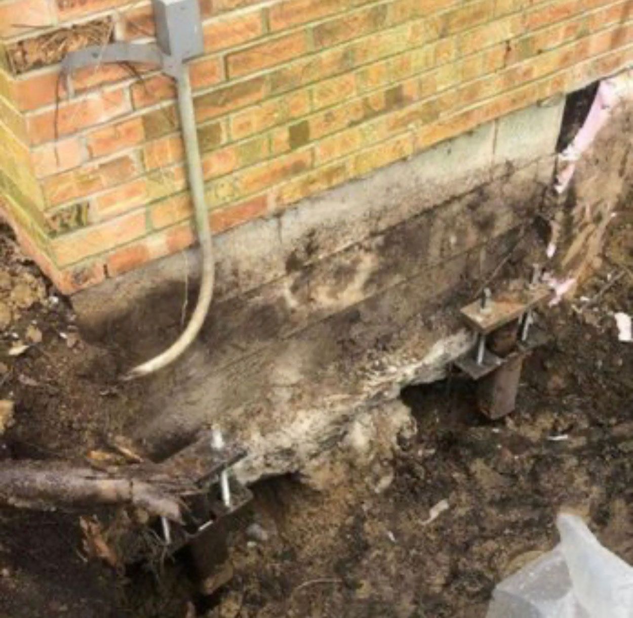 Repairing a house's wall and foundation