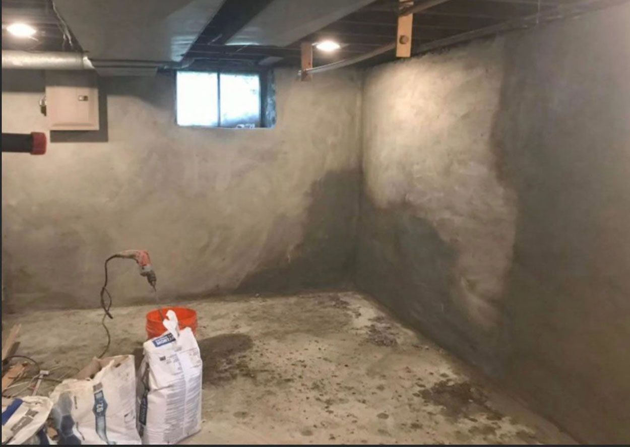 A basement with newly constructed concrete walls