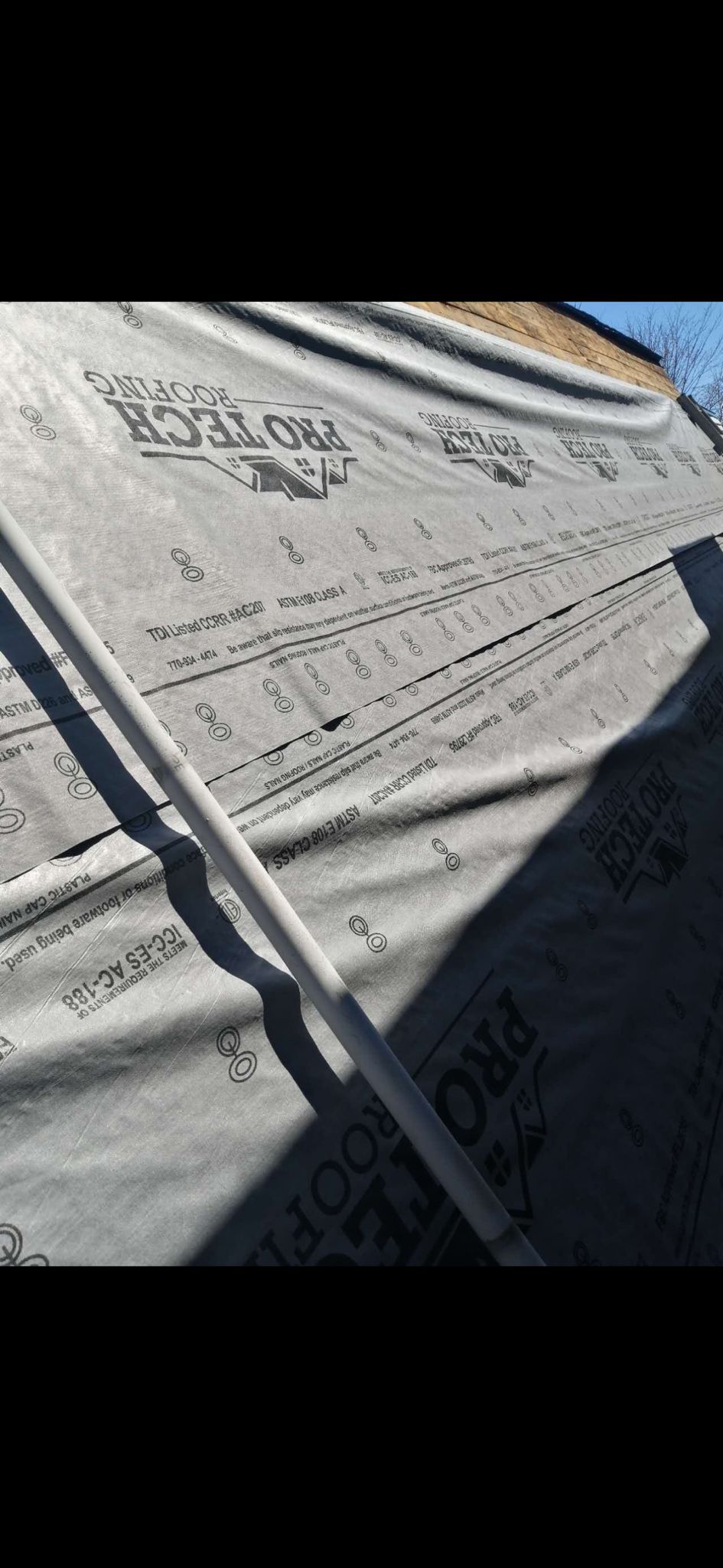 A close up of a piece of fabric on a roof.