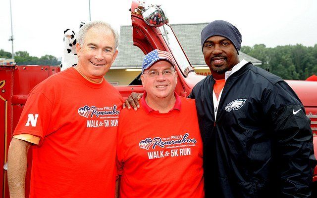 Three men wearing red shirts that say walk a 5k run