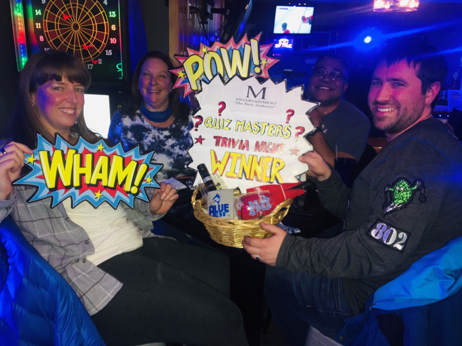 A group of people holding a sign that says pow