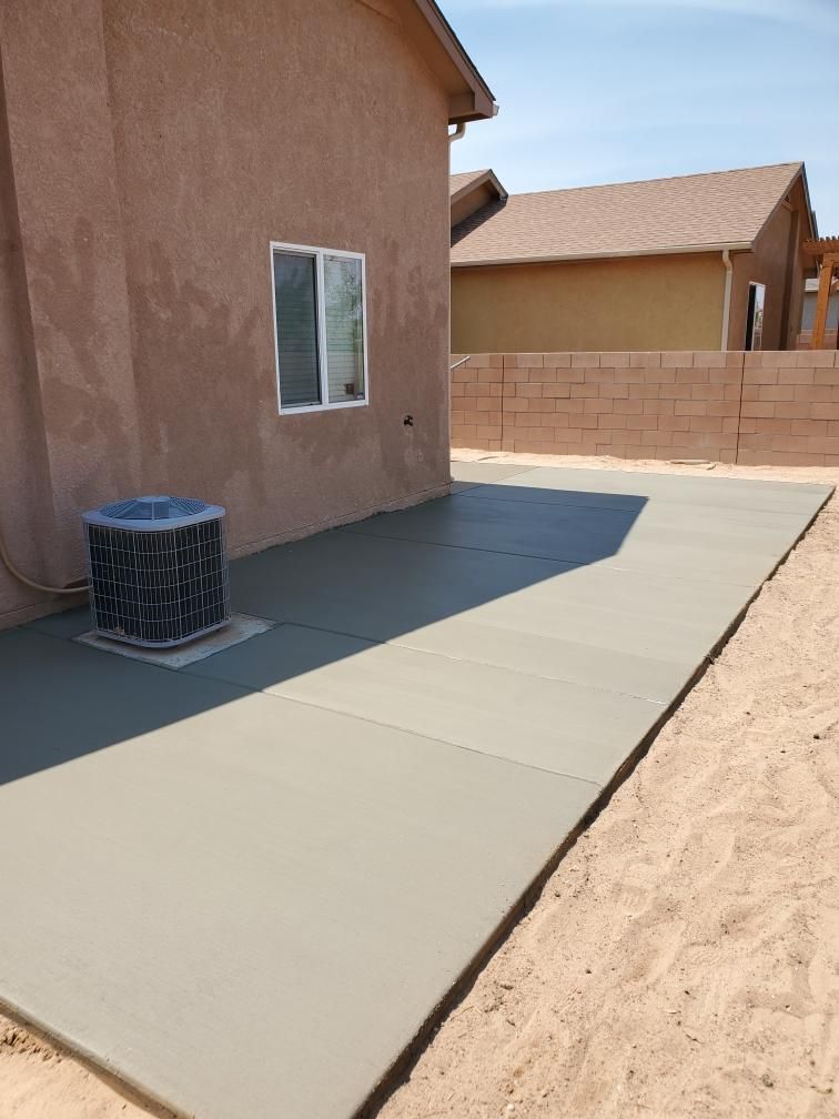 A house with a concrete patio in front of it