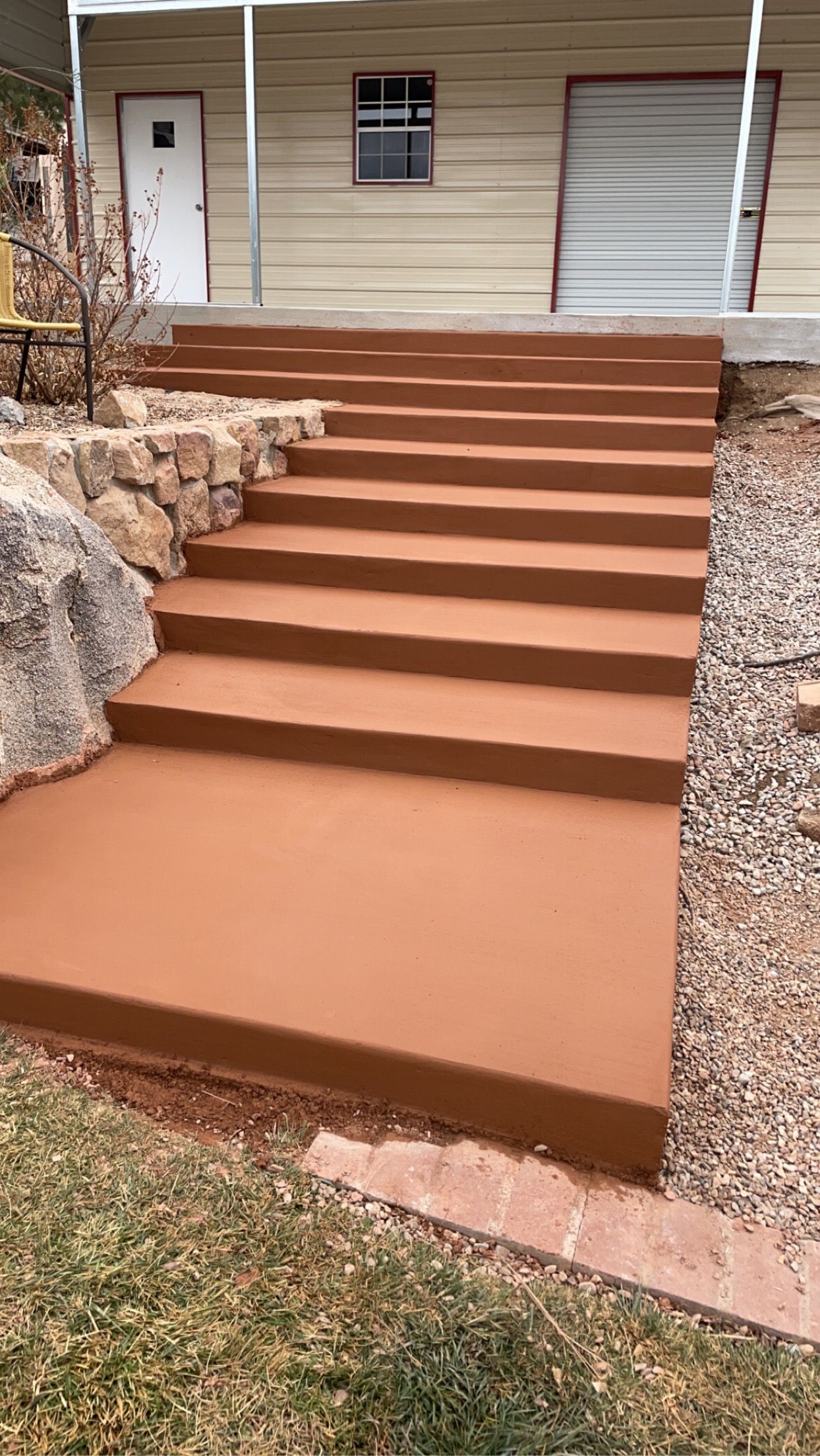 A set of concrete steps leading up to a house.