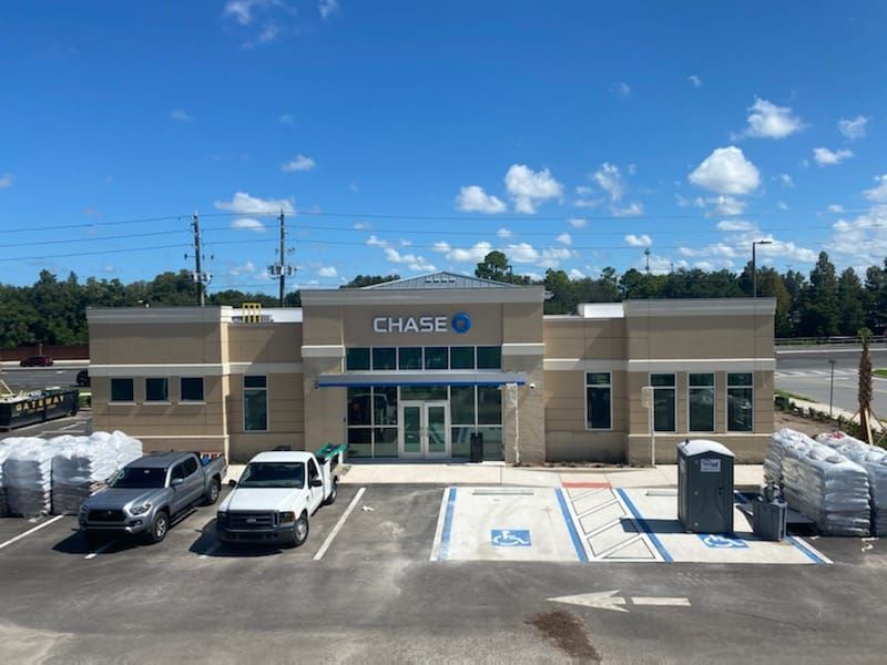 A chase bank with cars parked in front of it