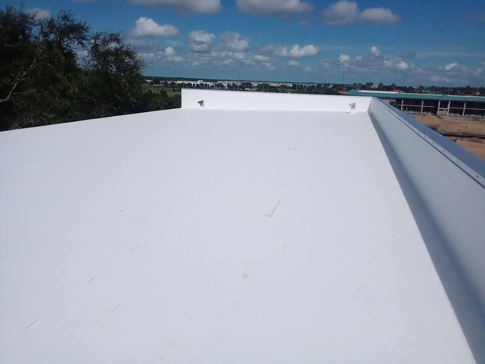 A white roof with a blue sky in the background