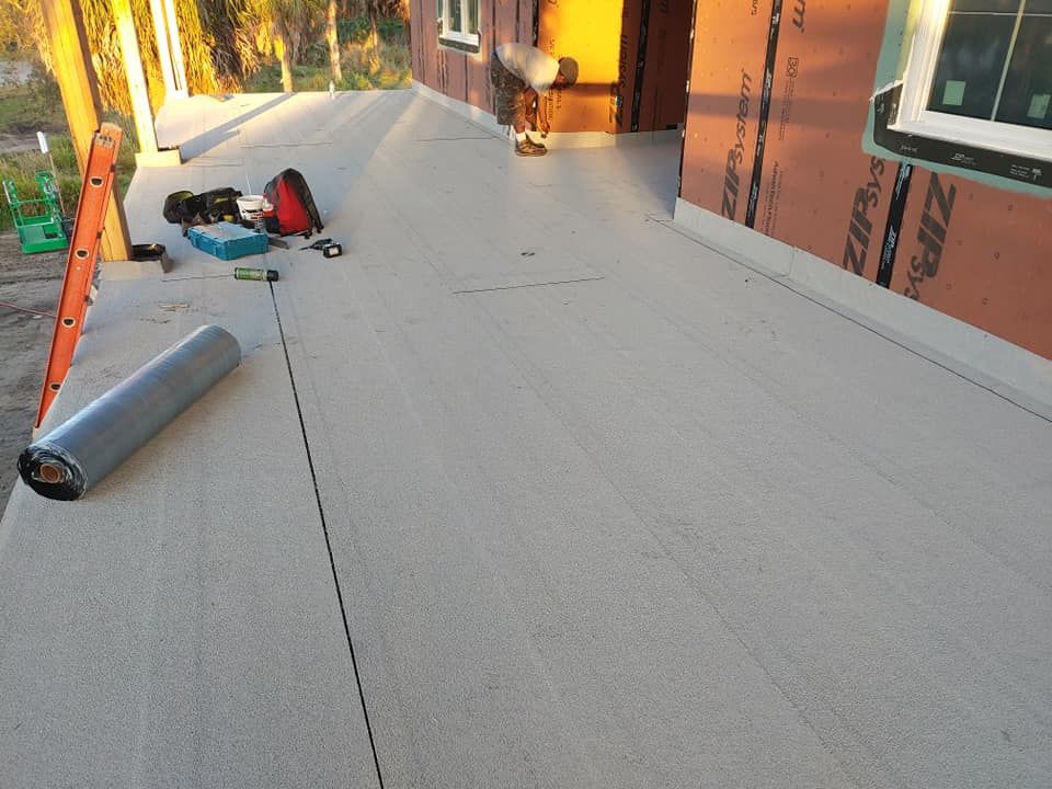 A roll of ziploc tape is laying on a porch