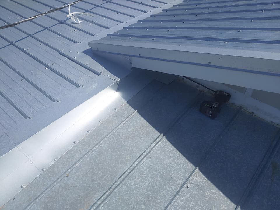 A close up of a roof with a drill on it.