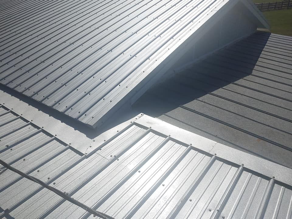 A close up of a metal roof with the sun shining through it
