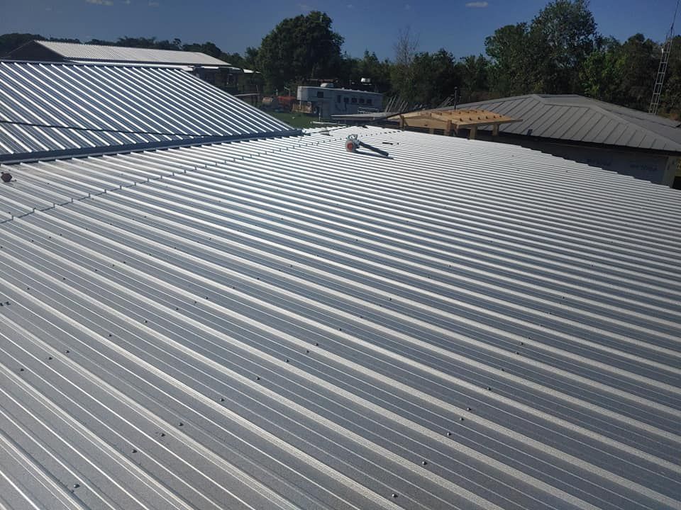 A metal roof with a blue sky in the background