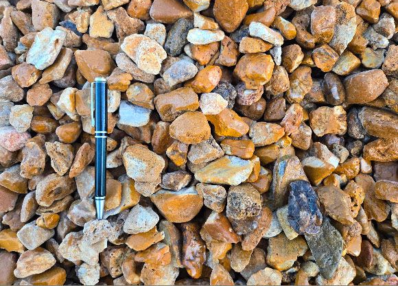 Meramec gravel in tan and gray, labeled sizes 3/4