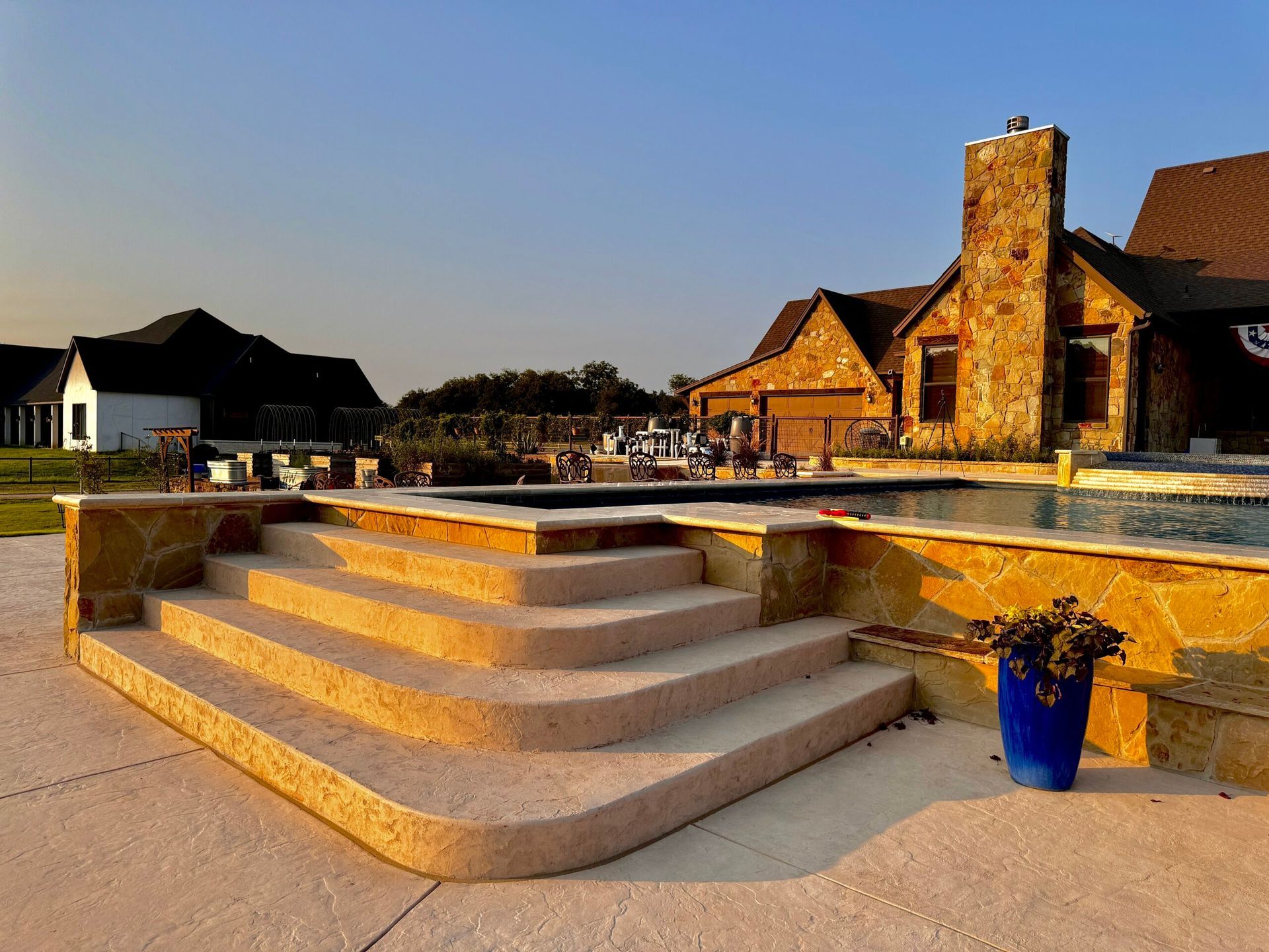 A house with a pool and stairs in front of it