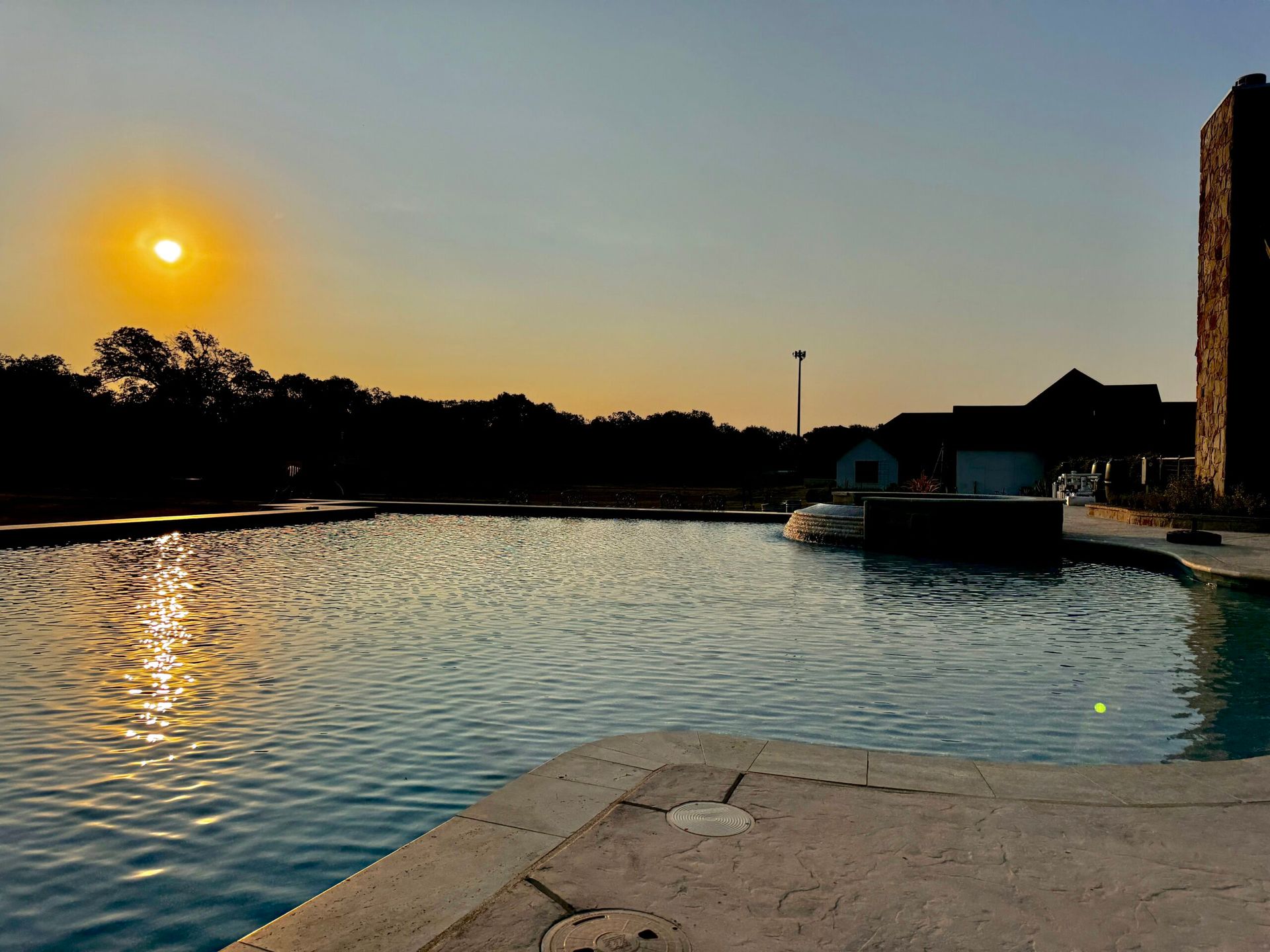 The sun is setting over a large body of water